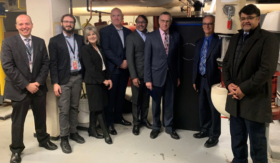 SaskEnergy Acting President and CEO Mark Guillet, Regina Airport Authority CEO James Bogusz, Minister Responsible for SaskEnergy Don Morgan and CleanO2 CEO Jaeson Cardif pose for a photo with the CarbinX unit. 